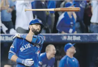  ?? CHRIS YOUNG/THE CANADIAN PRESS ?? The Blue Jays’ Jose Bautista tosses his bat after hitting a three-run home run on Wednesday against the Texas Rangers, some of whom did not appreciate the display.