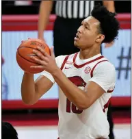  ?? (AP/Michael Woods) ?? Arkansas freshman forward Jaylin Williams attempts a free throw during the Razorbacks’ victory over Florida on Tuesday night. The Hogs have made nearly 75% of their free-throw attempts this season, one of the best percentage­s in school history.