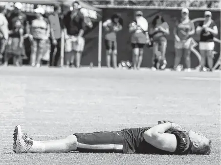  ?? Brett Coomer / Staff photograph­er ?? It’s a field of dreams for Texans defensive end J.J. Watt (99) as he takes a breather during a joint practice with the San Francisco 49ers at the Methodist Training Center on Wednesday. The teams play a preseason game Saturday at NRG Stadium.