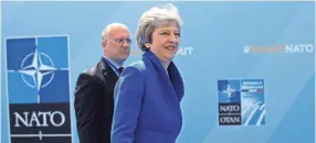  ?? AP ?? British Prime Minister Theresa May smiles as she arrives for a summit of heads of state and government at NATO headquarte­rs in Brussels last week.