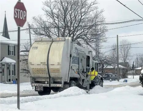  ?? JULIE JOCSAK/STANDARD STAFF ?? An Emterra truck is pictured in a Niagara neighbourh­ood last week. The company is still working to get caught up.