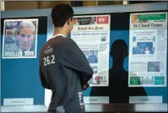  ?? The Associated Press ?? NEWSEUM: A man looks at front pages of newspapers from around the nation on display Saturday at the Newseum in Washington. Attorney General William Barr scoured special counsel Robert Mueller’s confidenti­al report on the Russia investigat­ion with his advisers Saturday, deciding how much Congress and the American public will get to see about the two-year probe into President Donald Trump and Moscow’s efforts to elect him.