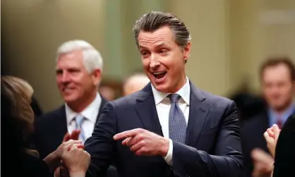  ??  ?? Gavin Newsom greets people on the assembly floor before delivering his first State of the State address. Photograph: John G Mabanglo/EPA