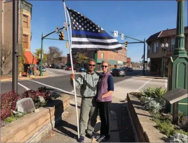  ?? JUSTIN RANSOM — THE NEWS-HERALD ?? Conrad and Didi Allen have walked throughout the state of Ohio showing support of police and veterans. On Nov. 6, the couple began walking from Geneva to Mentor.