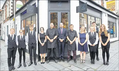  ??  ?? Head chef Sam Pendry, centre left, and manager Dan Walbridge, centre right, with the Sky Restaurant team