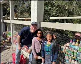  ?? COURTESY OF MARC SCHAFFER ?? Superinten­dent Marc Schaffer with two young residents of the rural Guatemalan village of Agua Escondida, midway through building the children’s school. Schaffer visited the village between Jan. 19and Jan. 25 to help build the school.