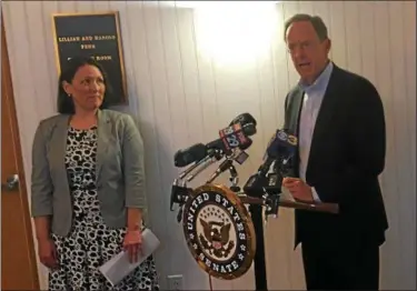  ?? GARY PULEO — DIGITAL FIRST MEDIA ?? With Kristen Tullo, Pennsylvan­ia State Director of the Human Society of the United States, looking on, U.S. Sen. Pat Toomey, R-Pa., announced details on PACT, a bill that seeks to outlaw animal cruelty, at the Montgomery County SPCA.