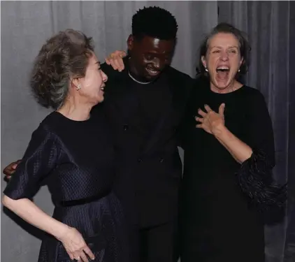  ?? Photo: AP ?? Yuh-Jung Youn, from left, winner of the award for best actress in a supporting role for "Minari," Daniel Kaluuya, winner of the award for best actor in a supporting role for "Judas and the Black Messiah," and Frances McDormand, winner of the award for best actress in a leading role for "Nomadland," pose outside the press room at the Oscars on Sunday at Union Station in Los Angeles.