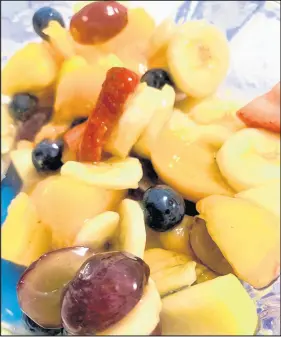  ?? PHILIP POTEMPA/POST-TRIBUNE ?? Assorted prepared fresh fruit combined with the surprise ingredient of peach pie filling creates an easy and delicious colorful fruit salad.