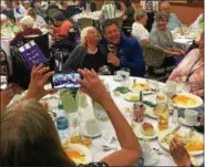  ?? DAN SOKIL — DIGITAL FIRST MEDIA ?? Virginia Flamer, 102, of Philadelph­ia leans in for a photo with Elvis Presley tribute artist Dean Garofolo at a luncheon for centenaria­ns hosted by the Montgomery County Office of Aging and Adult Services on Thursday.