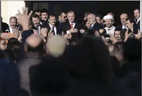  ??  ?? Turkish President Recep Tayyip Erdogan (center), thanks the crowd during his visit in the northeaste­rn Greek town of Komotini on Friday. AP PHOTO/GIANNIS PAPANIKOS