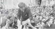  ??  ?? Robert F. Kennedy campaigns for the U.S. Democratic Party's presidenti­al nomination in Philadelph­ia on April 2, 1968. He was assassinat­ed two months later.