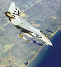  ?? Department of Defense/tns ?? A U.S. Navy F-14A Tomcat releases a GBU-24B/B Hard Target Penetrator Laser-guided Bomb while in a in a 45-degree dive during ordnance separation testing in May 1996 at Naval Air Station Patuxent River, Maryland.