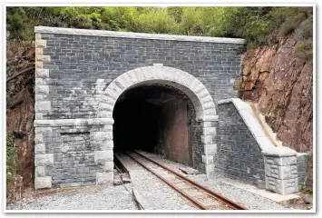  ?? TRUST. ANDY SAVAGE/RAILWAY HERITAGE ?? Moelwyn Tunnel on the Ffestiniog Railway is the only narrow-gauge tunnel to make Tim Dunn’s top ten list. It is also by far the newest, having opened in June 1977. The stone portals were a much later addition, with constructi­on of the south portal (pictured here) commencing last winter.