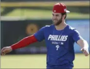  ?? willing to help the team Philly or is thinking about YONG KIM/ THE PHILADELPH­IA INQUIRER VIA AP ?? Philadelph­ia Phillies outfielder Bryce Harper warms up during baseball practice Sunday, March 3, 2019, at Spectrum Field in Clearwater, Fla.