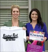  ?? KAYLA BAUGH/CONTRIBUTI­NG PHOTOGRAPH­ER ?? Lauren Shoot, president of the Kiwanis Club of Beebe, left, holds up the T-shirt for the Painted Path Fun Run 5K while Leslie Richardson displays the promotiona­l sign for the race. All proceeds from the run will benefit the Kiwanis of Beebe Scholarshi­p...