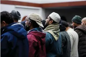  ?? Dieu-Nalio Chery/Reuters ?? Palestinia­n Americans pray at a mosque in Dearborn, Michican, on 4 February. Photograph: