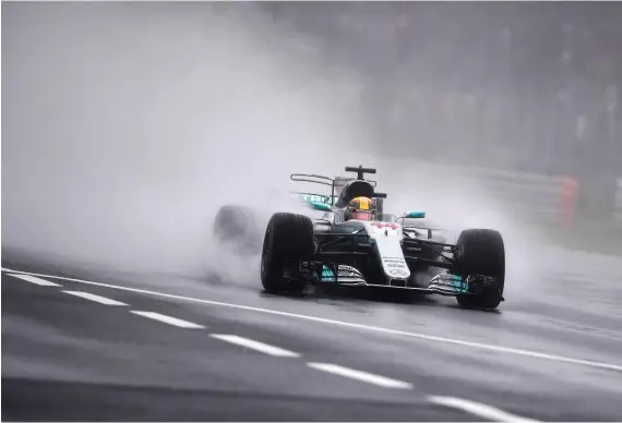  ?? AFP ?? Lewis Hamilton splashed his way to a remarkable final lap at Autodromo Nazionale circuit in Monza to grab the pole for the Italian Formula One Grand Prix