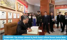  ?? — AFP ?? 7@65.@(5.! ;OPZ WPJ[\YL YLSLHZLK I` 5VY[O 2VYLH»Z VMÄJPHS 2VYLHU *LU[YHS 5L^Z Agency shows China’s top lawmaker Zhao Leji (left) signing the guest book during a visit to the Friendship Tower in Pyongyang on April 12, 2024.