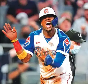  ?? AP PHOTO/JOHN BAZEMORE ?? The Atlanta Braves’ Ronald Acuna Jr. reacts after scoring on Ozzie Albies’ sacrifice fly against the Miami Marlins on Monday in Atlanta. The game was in extra innings at press time. Please go to timesfreep­ress.com for coverage.