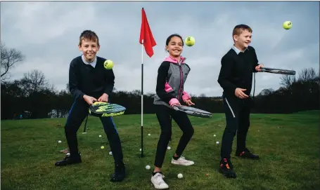  ?? ?? Youngsters Igor, Heba and Dylan from St Philomena’s Primary School try out the game of padel at Lethamhill Golf Course in Glasgow