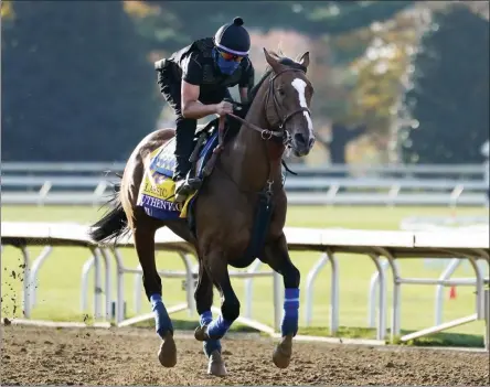  ?? THE ASSOCIATED PRESS ?? Kentucky Derby winner Authentic is taken for a workout at the Breeders’ Cup World Championsh­ip horse races at Keeneland Race Course Thursday, Nov. 5, 2020, in Lexington, Ky. Authentic is scheduled to run in the Breeders’ Cup Classic race Saturday.