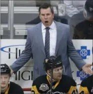  ?? GENE J. PUSKAR — THE ASSOCIATED PRESS ?? Pittsburgh Penguins coach Mike Sullivan makes his point to an official during the first period of an NHL hockey game against the Tampa Bay Lightning in Pittsburgh. The Stanley Cup has been handed out 89 times to the champion of the NHL since 1927. For...