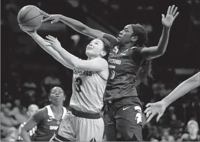  ?? [ROBERT FRANKLIN/THE ASSOCIATED PRESS] ?? Michigan State’s Victoria Gaines blocks a shot attempt by Central Michigan’s Presley Hudson during Saturday’s NCAA Tournament game.