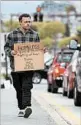  ?? ROBERT F. BUKATY/AP ?? Derek Cote says he’ll participat­e in a program for panhandler­s in Portland, Maine.