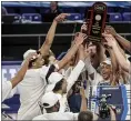  ?? DANIEL LIN — FOR THE ASSOCIATED PRESS ?? Drexel celebrates its win over Elon in the CAA tournament championsh­ip game. The victory earned the Dragons their first trip to the NCAA Tournament in 25 years.