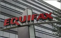  ?? AP PHOTO/MIKE STEWART ?? This July 21, 2012, file photo shows signage at the corporate headquarte­rs of Equifax Inc. in Atlanta.