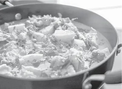  ?? ANDREW RUSH/PITTSBURGH POST-GAZETTE PHOTOS ?? Potatoes and peas are cooked in an almond-coconut sauce for this korma.
Makes: