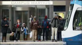  ?? THE ASSOCIATED PRESS ?? Passengers wait on the QLINE transit train in Detroit.