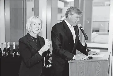  ?? [PHOTO PROVIDED] ?? Christy Everest presents the Gaylord Prize in 2014 while standing next to Oklahoma Medical Research Foundation President Dr. Stephen Prescott.