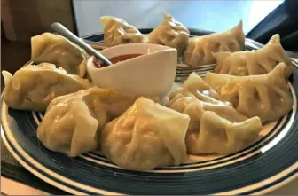  ?? Melissa McCart/Post-Gazette photos ?? Vegetable momos are stuffed with plenty of ginger at Himali Kitchen in Brentwood.