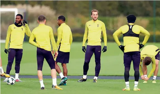  ?? — AP ?? Tottenham’s star striker Harry Kane ( third from right) may play against Arsenal on Saturday after missing England’s friendlies against Germany and Brazil.