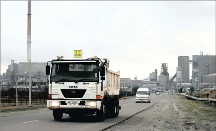  ??  ?? Trucks leave an Anglo American Platinum processing plant near Rustenburg. Platinum companies have to survive in a low-price environmen­t.