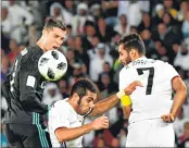  ??  ?? Real Madrid's Cristiano Ronaldo (L) vies for the header with Al Jazira's Emirati’s Musallem Fayez (C) and Ali Mabkhout (R) during the FIFA Club World Cup semi-final match.