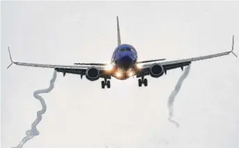  ?? Yi-Chin Lee photos / Staff photograph­er ?? A Boeing 737 MAX 8 operated by Southwest Airlines arrives for a landing Wednesday at Hobby Airport, where it was immediatel­y grounded.