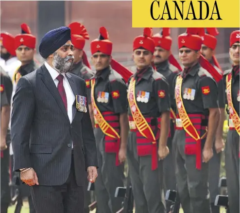  ?? MANISH SWARUP / THE ASSOCIATED PRESS ?? Defence Minister Harjit Sajjan, inspecting an honour guard in New Delhi, India on April 18, says he personally inserted comments into a speech he made that day inflating his role in a key 2006 Afghanista­n battle.