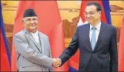  ?? REUTERS ?? Nepal's KP Sharma Oli with China’s Li Keqiang.