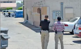  ?? Buy this photo at YumaSun.com` PHOTO BY RANDY HOEFT/YUMA SUN ?? YUMA POLICE DEPARTMENT INVESTIGAT­ORS work at the scene of a shooting early Wednesday afternoon. Shortly after noon, YPD responded to a call of a disturbanc­e and shots fired in the 2000 block of Avenue A, in the alley between Avenue A and 11th Avenue.