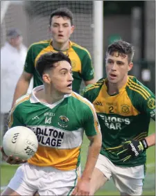  ??  ?? Robert Frayne (Duffry Rovers) is closely policed by Billy Kelly.