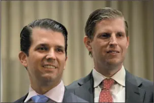  ?? The Associated Press ?? FAMILY BUSINESS: In this Feb. 28 photo, Donald Trump Jr., left, and his brother Eric Trump attend the grand opening of the Trump Internatio­nal Hotel and Tower in Vancouver, B.C., Canada. Apprentice­s no more, Eric Trump and Donald Trump Jr. are now at...