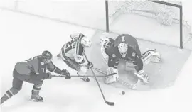  ?? JOEL AUERBACH/AP ?? Panthers goalie Roberto Luongo stops a shot by New York Rangers center Derek Stepan on Saturday. The Panthers won 3-0, the eighth victory in a row. The streak is now nine.