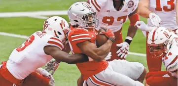  ?? JAY LAPRETE/AP ?? Ohio State running back Master Teague III scored two touchdowns in a 52-17 win over Nebraska to open the season, but he and the Buckeyes often struggled in the running game against the Cornhusker­s.