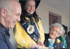  ??  ?? Blessingto­n girl Lara Gilmore cutting the cake at the Brownie centenary celebratio­n with Today FM’s Ray D’Arcy and 93-year-old Hazel Shiel, who is one of the Irish Girl Guide’s oldest members.