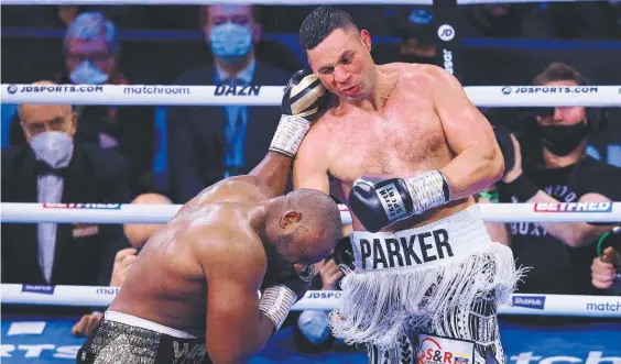  ?? ?? Joseph Parker and Derek Chisora exchange punches during the WBO Interconti­nental Heavyweigh­t Title fight. Picture: Alex Livesey/Getty Images.