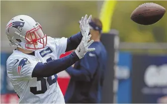  ?? STAFF PHOTO BY NANCY LANE ?? GOOD CATCH: Running back Rex Burkhead has experience at receiver, but it seems unlikely he’ll line up that way on Sunday.