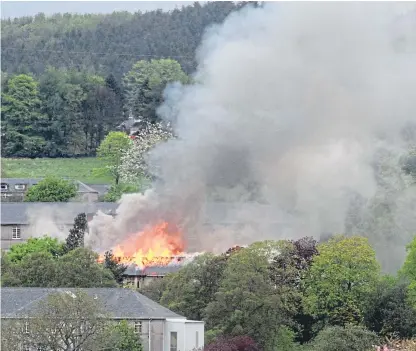  ??  ?? Strathmart­ine Hospital ablaze as figures are released by the Scottish Fire and Rescue Service.